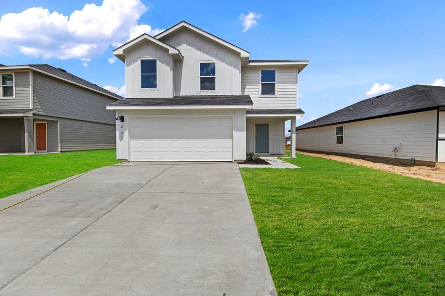 Front exterior of a new home in Ladera, Luling, TX, highlighting curb appeal (Image 2). Front exterior of a new home in Ladera, Luling, TX, highlighting curb appeal (Image 2).