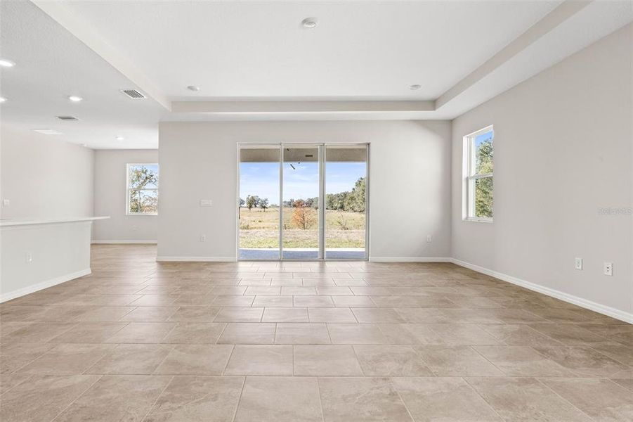 Glass sliders frame the open space to the back yard.