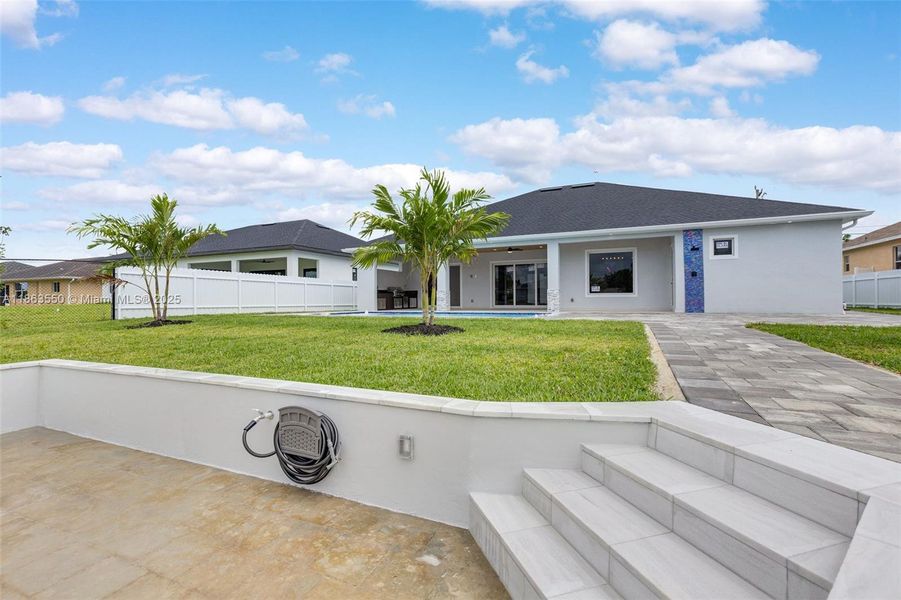 Front exterior of a new home in , Cape Coral, FL, highlighting curb appeal (Image 2). Front exterior of a new home in , Cape Coral, FL, highlighting curb appeal (Image 2).
