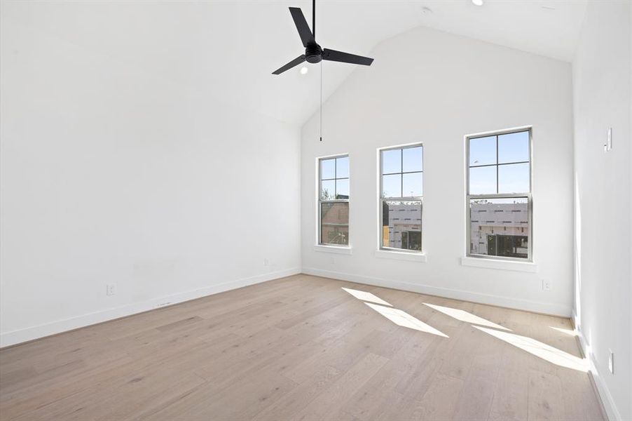 Cathedral ceilings and mucho natural light in Primary Bedroom