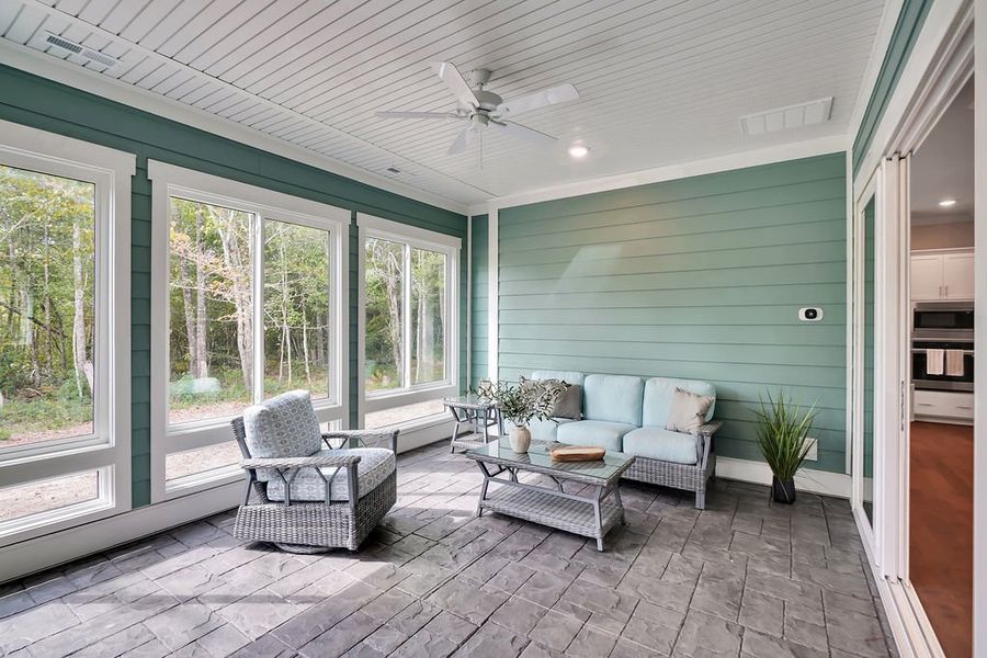 Exterior details and patio area of a home in The Bluffs On the Cape Fear, Leland (Image 3).