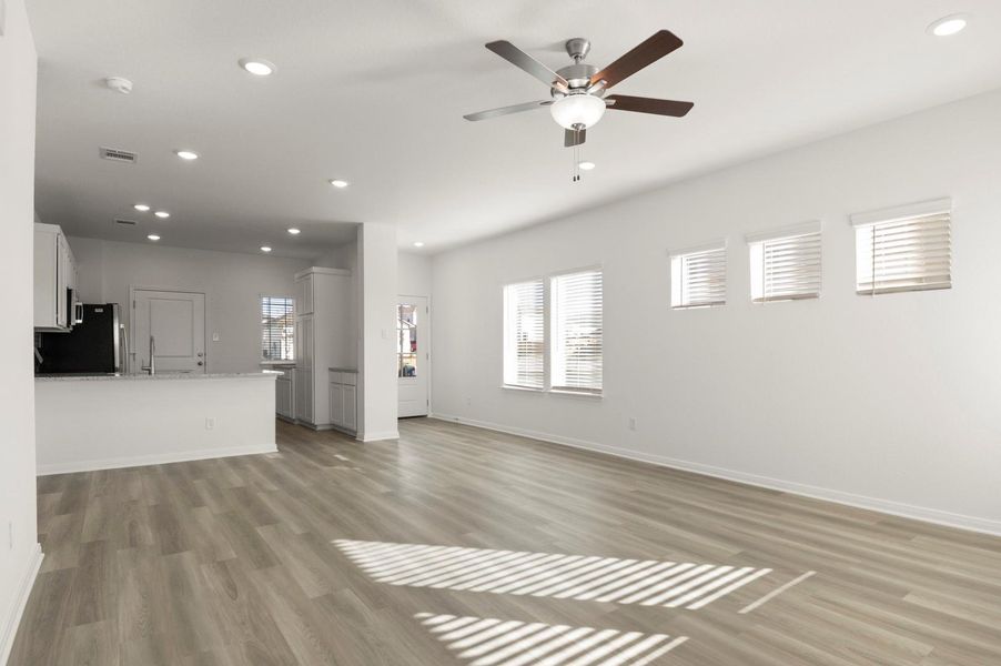 Unfurnished living room with recessed lighting, light wood-type flooring, and ceiling fan