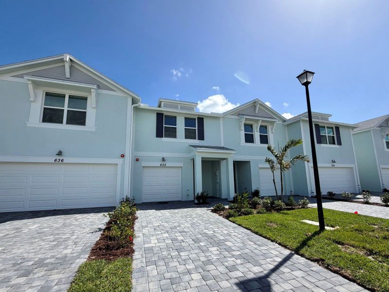 Front exterior of a new home in Tidewater, Fort Pierce, FL, highlighting curb appeal (Image 10). Front exterior of a new home in Tidewater, Fort Pierce, FL, highlighting curb appeal (Image 10).