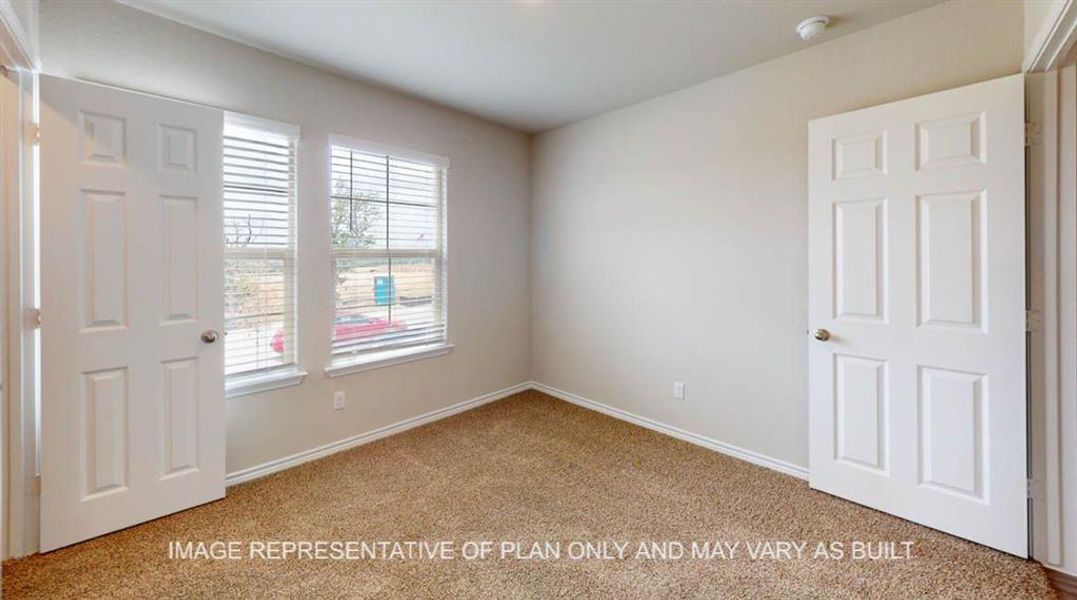 Unfurnished bedroom featuring light colored carpet and baseboards Unfurnished bedroom featuring light colored carpet and baseboards
