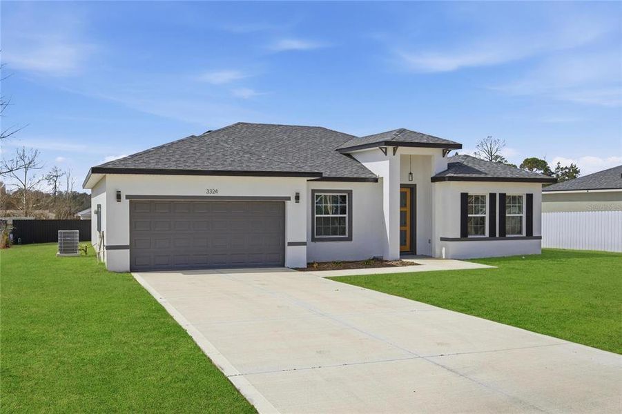 Front exterior of a new home in , Ocala, FL, highlighting curb appeal (Image 26). Front exterior of a new home in , Ocala, FL, highlighting curb appeal (Image 26).