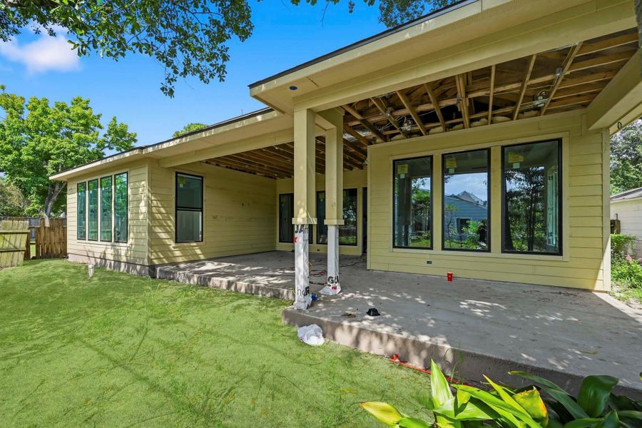 Out back is a massive covered patio with outdoor kitchen! Out back is a massive covered patio with outdoor kitchen!