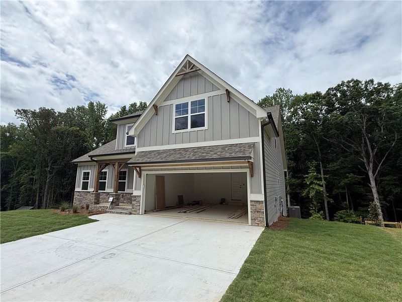 Front exterior of a new home in , Waleska, GA, highlighting curb appeal (Image 1). Front exterior of a new home in , Waleska, GA, highlighting curb appeal (Image 1).