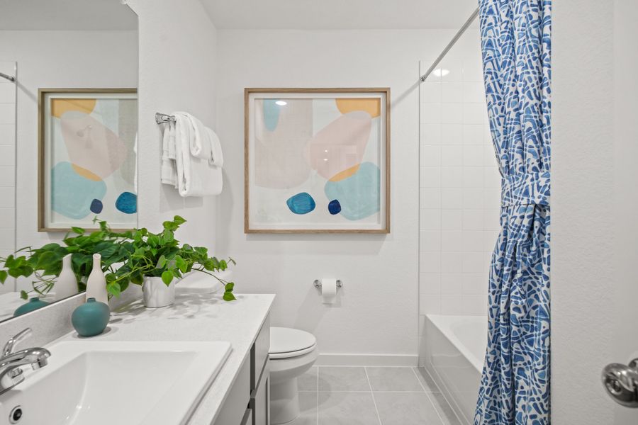 Bathroom in the Oak home plan by Trophy Signature Homes – REPRESENTATIVE PHOTO