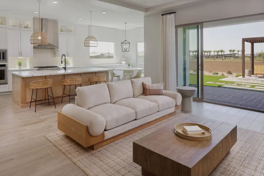 Great room and kitchen. Finishes and options may vary by community.