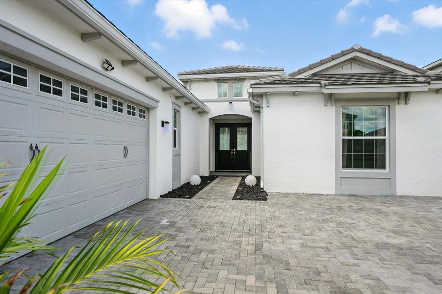 Front exterior of a new home in , Westlake, FL, highlighting curb appeal (Image 22).