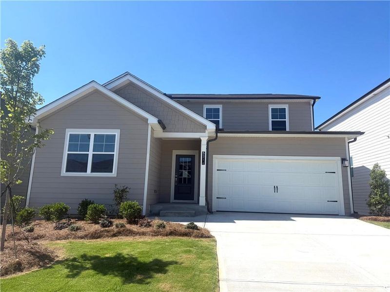 Front exterior of a new home in Union Heights, Flowery Branch, GA, highlighting curb appeal (Image 1). Front exterior of a new home in Union Heights, Flowery Branch, GA, highlighting curb appeal (Image 1).