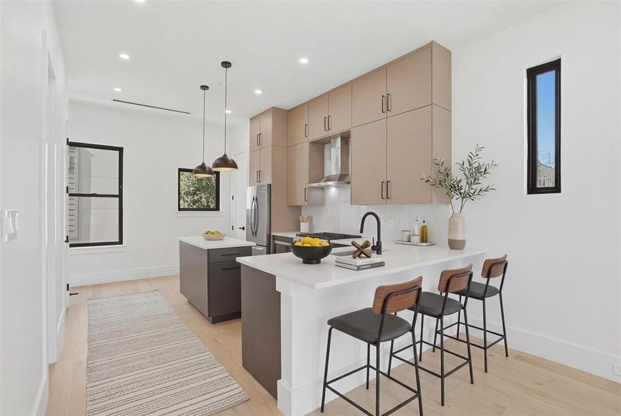 Any chef will feel at home in this kitchen! Loaded with upgrades: custom cabinetry with designer hardware, quartz countertops and a full S/S appliance package from the Frigidaire Gallery series. Island has additional storage!