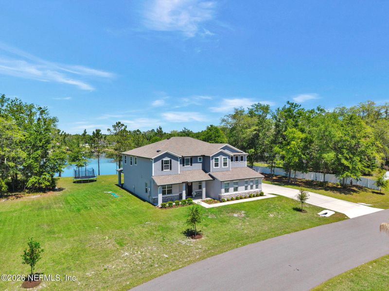 Front exterior of a new home in , Middleburg, FL, highlighting curb appeal (Image 27).