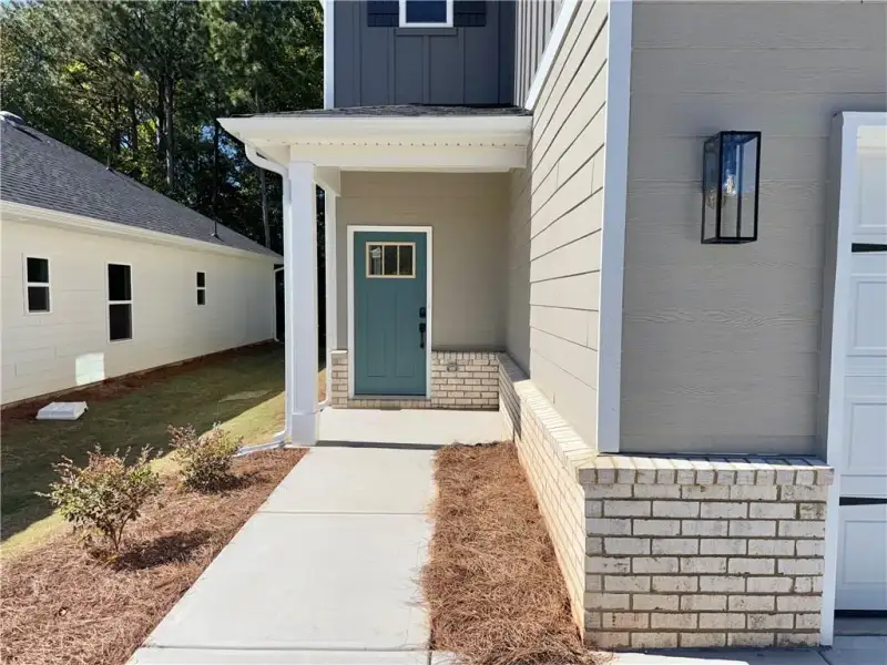 Exterior details and patio area of a home in Canterbury Villas, Carrollton (Image 3).