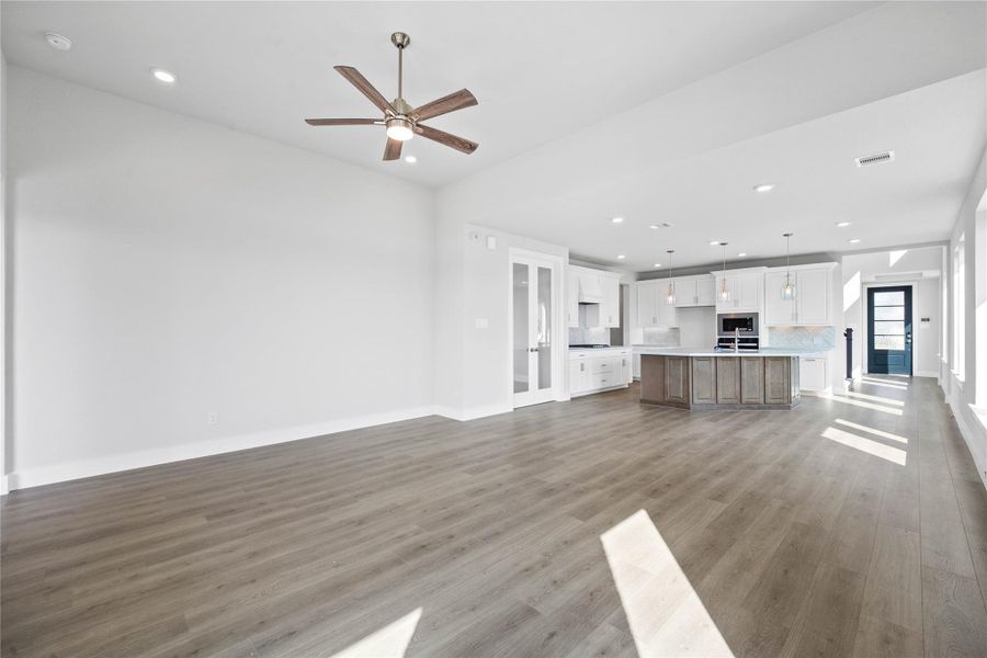 Stunning open-concept design seamlessly connecting the living, dining, and kitchen areas—perfect for both everyday living and entertaining!