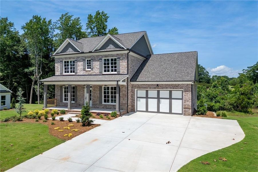 Front exterior of a new home in , Buford, GA, highlighting curb appeal (Image 31).