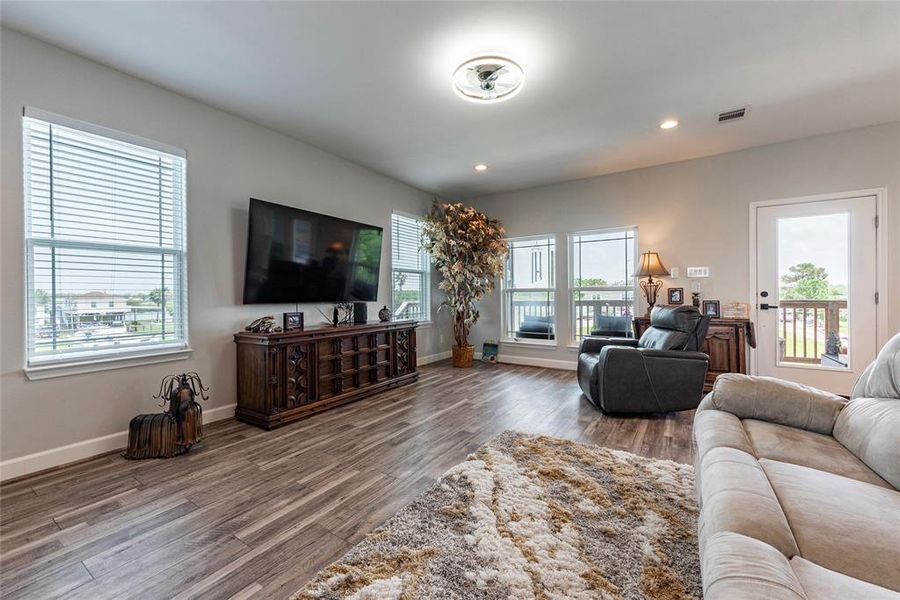 This beautifully designed open floor plan seamlessly connects the living and dining areas, creating a spacious and welcoming environment for gatherings and everyday living.