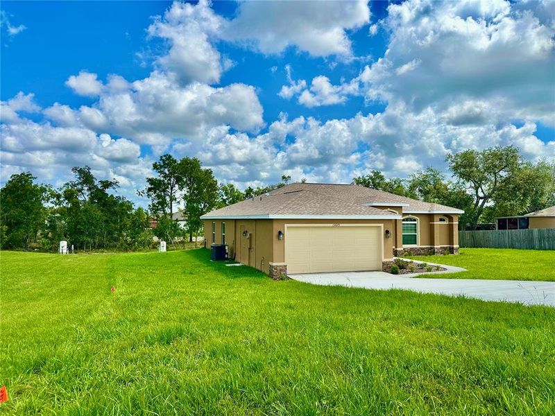 Front exterior of a new home in , Weeki Wachee, FL, highlighting curb appeal (Image 29).