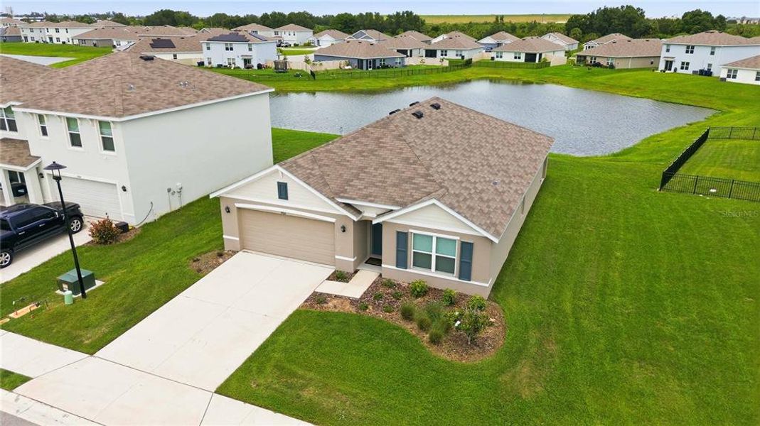 Front exterior of a new home in Mandarin Grove, Palmetto, FL, highlighting curb appeal (Image 23).