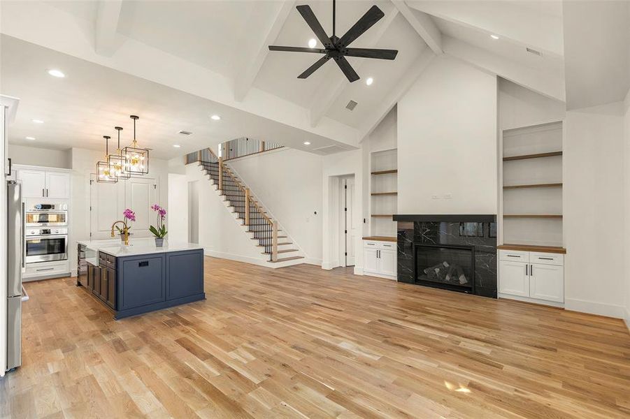 view 2 from the back of the great room, on the right you notice the solid white oak staircase that ascends to a spacious game room and 3 additional bedrooms with ensuite baths