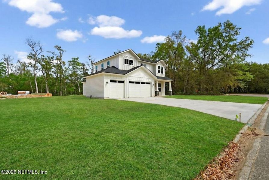 Front exterior of a new home in , Yulee, FL, highlighting curb appeal (Image 34). Front exterior of a new home in , Yulee, FL, highlighting curb appeal (Image 34).