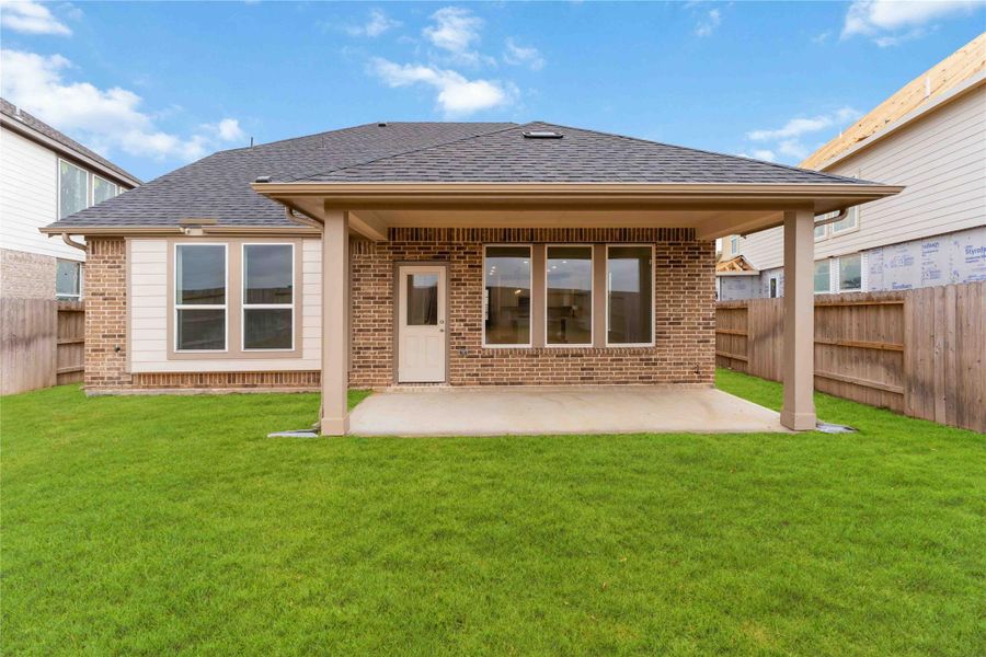 Exterior details and patio area of a home in Sunterra, Katy (Image 4).