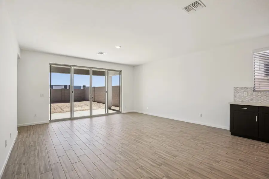 Great room with 4 panel slider. Not actual home, finishes and options may vary. Great room with 4 panel slider. Not actual home, finishes and options may vary.