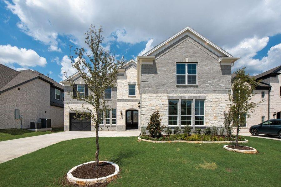 Front exterior of a new home in Wellspring Estates, Celina, TX, highlighting curb appeal (Image 18). Front exterior of a new home in Wellspring Estates, Celina, TX, highlighting curb appeal (Image 18).