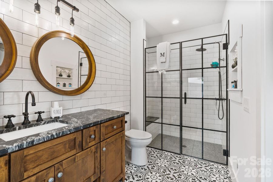 Subway tiled walk-in shower with bench seating Subway tiled walk-in shower with bench seating