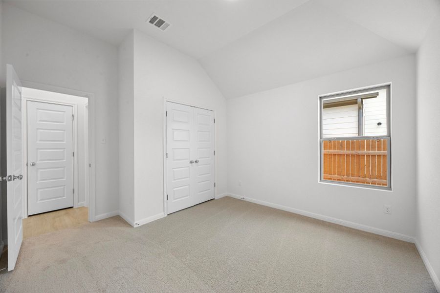 Bedroom in the Cypress home plan by Trophy Signature Homes - REPRESENTATIVE PHOTO Bedroom in the Cypress home plan by Trophy Signature Homes - REPRESENTATIVE PHOTO