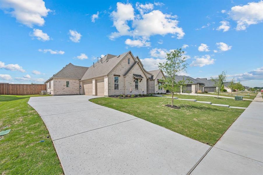 Front exterior of a new home in NorthGlen, Haslet, TX, highlighting curb appeal (Image 25).