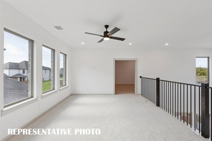 Entertaining is a breeze in this spacious, light filled game room!  REPRESENTATIVE PHOTO