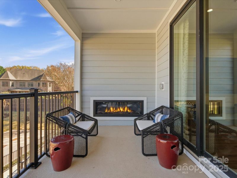 Elevated Covered Outdoor Living with Electric Fireplace. *Model Photos | Actual Finishes, Structural Selections, and Orientation May Vary.