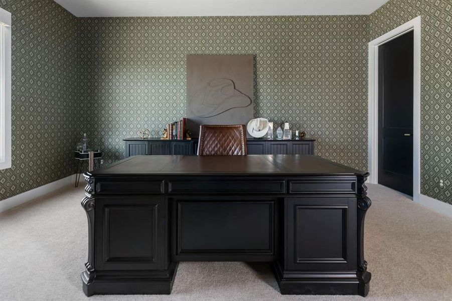 Office featuring light colored carpet and wallpapered walls Office featuring light colored carpet and wallpapered walls