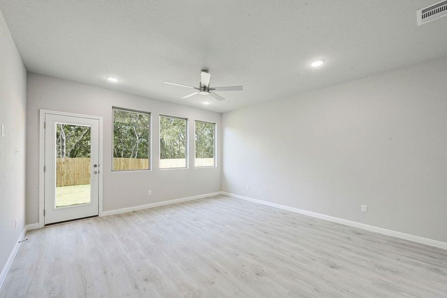 Living Room in the Willow home plan by Trophy Signature Homes – REPRESENTATIVE PHOTO