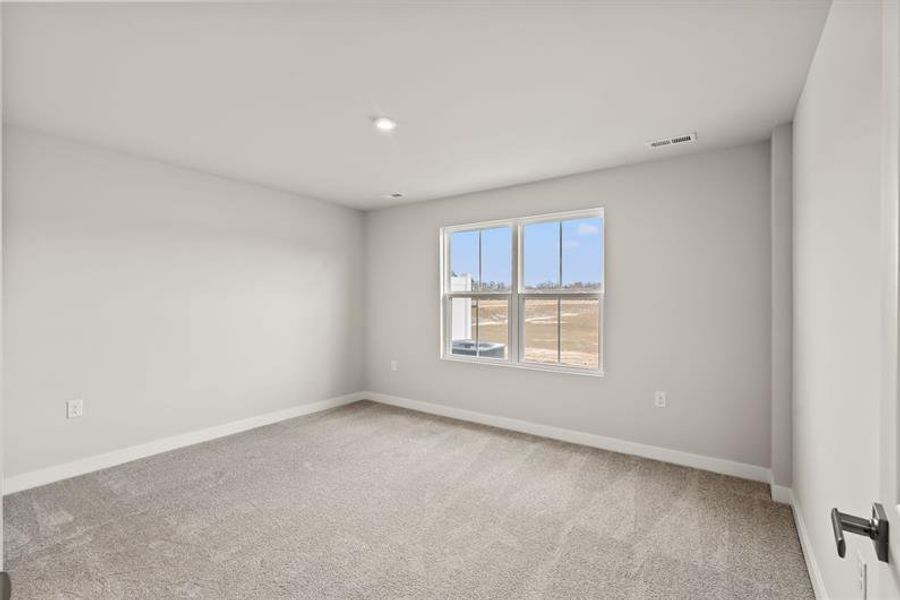 Spacious, unfurnished interior of a new home in Lakes at Riverbend Townhomes, Navassa (Image 15).