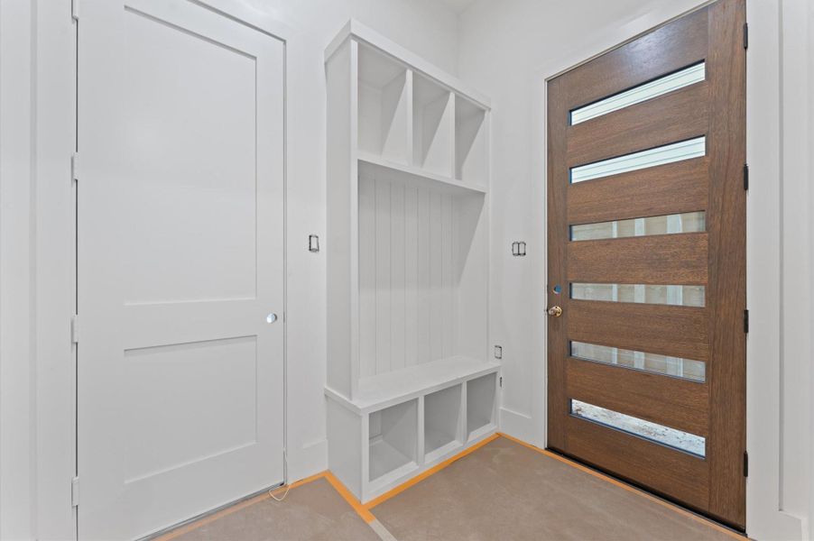 The mudroom is conveniently located immediately upon entry, which allows for practical storage. The mudroom is conveniently located immediately upon entry, which allows for practical storage.
