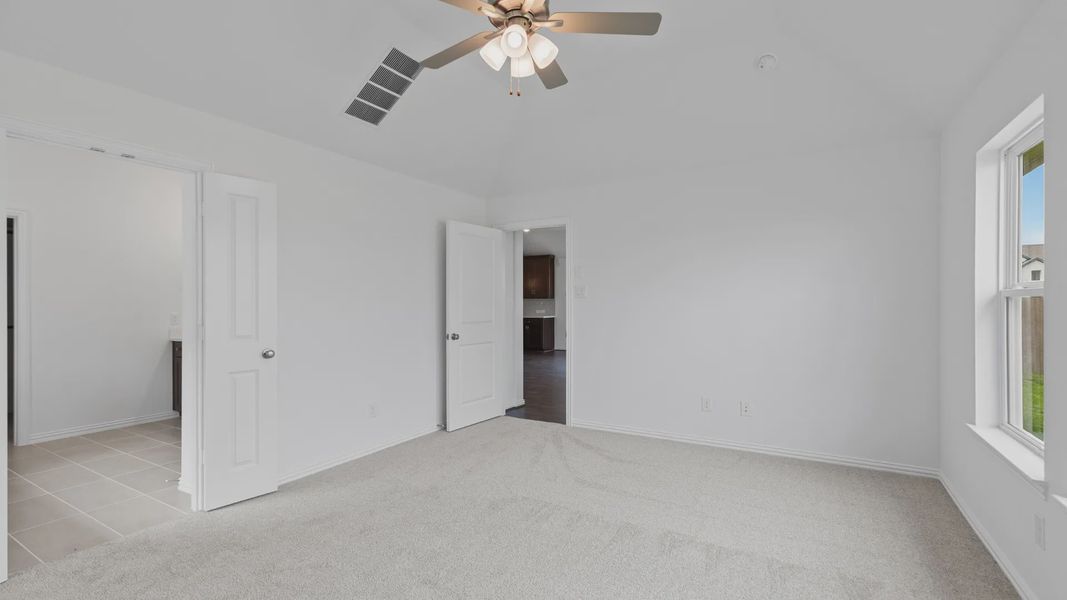 Furnished interior view inside a new home in Sunterra, Katy (Image 21).