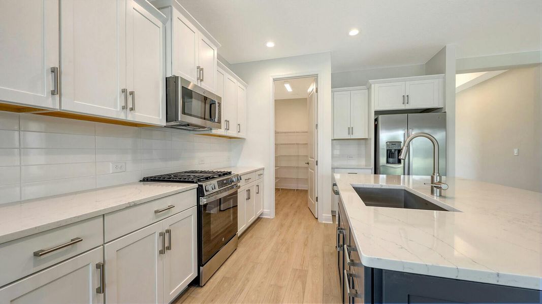 Furnished interior view inside a new home in Palm Grove Real Estate and Homes for Sale in Lakewood Ranch, FL - Neal Communities, Lakewood Ranch (Image 6).