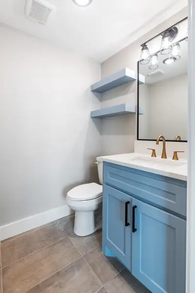 Bathroom with toilet and vanity Bathroom with toilet and vanity