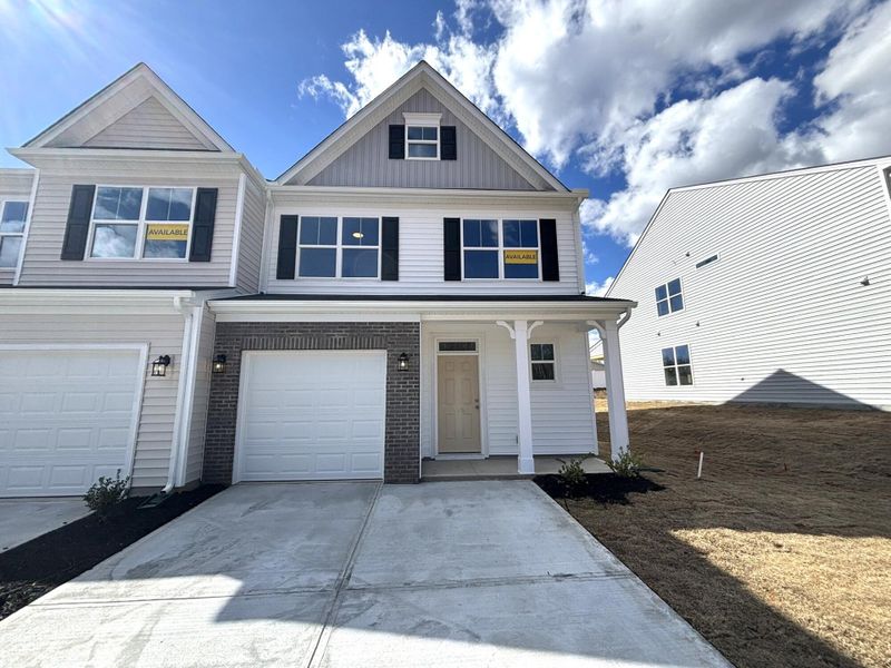 Front exterior of a new home in CraigStone, Woodruff, SC, highlighting curb appeal (Image 1). Front exterior of a new home in CraigStone, Woodruff, SC, highlighting curb appeal (Image 1).