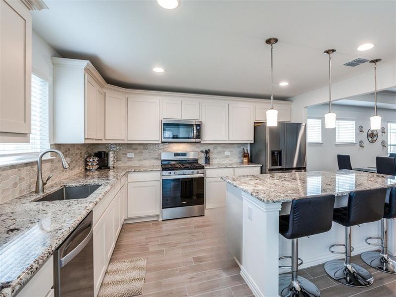 Pendant lighting, eatin kitchen with large pantry