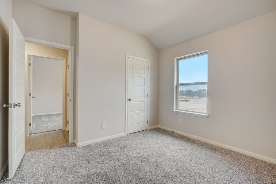 Guest room in the Oleander floorplan at a Meritage Homes community.