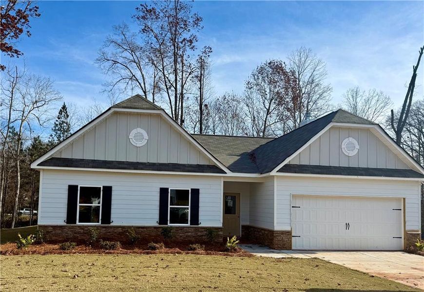 Front exterior of a new home in , Villa Rica, GA, highlighting curb appeal (Image 1). Front exterior of a new home in , Villa Rica, GA, highlighting curb appeal (Image 1).
