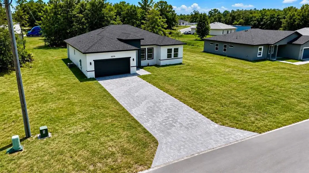 Front exterior of a new home in , Ocala, FL, highlighting curb appeal (Image 27).