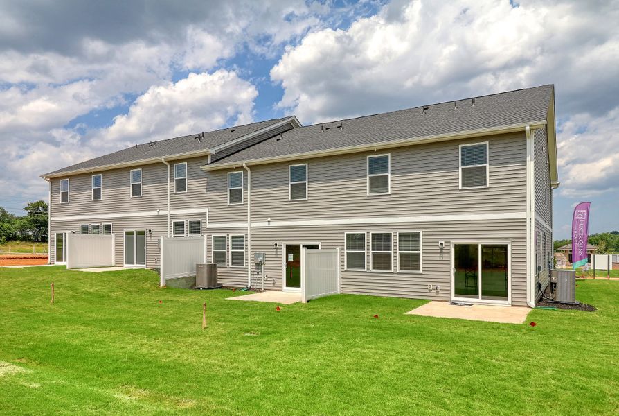 Representative exterior photo of a completed home built from the Ivey by Hunter Quinn Homes in Westgate Village Townes, Spartanburg, SC (Image 22). Representative exterior photo of a completed home built from the Ivey by Hunter Quinn Homes in Westgate Village Townes, Spartanburg, SC (Image 22).