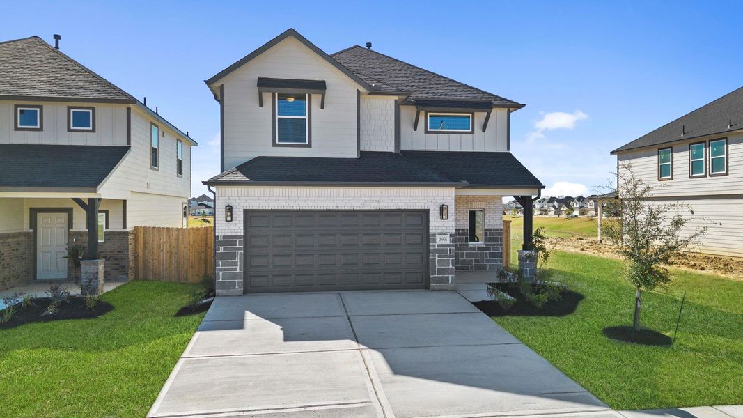 Front exterior of a new home in Grand Oaks Village, Houston, TX, highlighting curb appeal (Image 15).