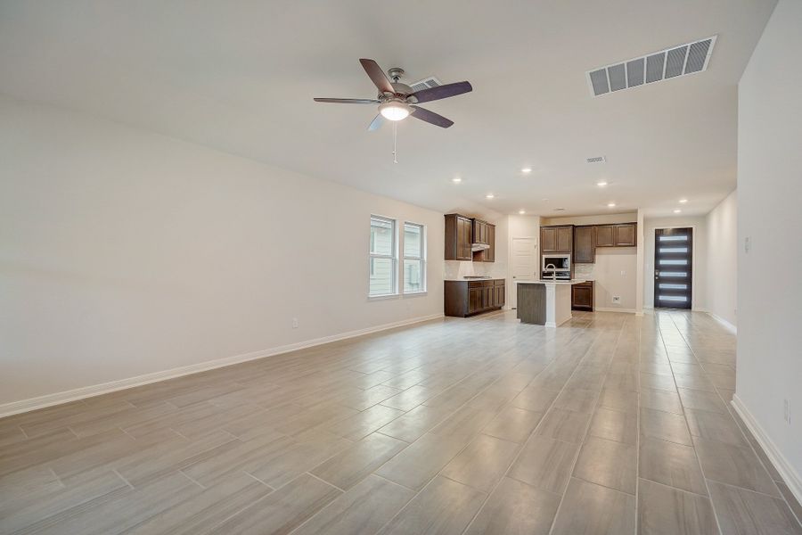 Living room, dining room, and kitchen in the Oleander floorplan at a Meritage Homes community.