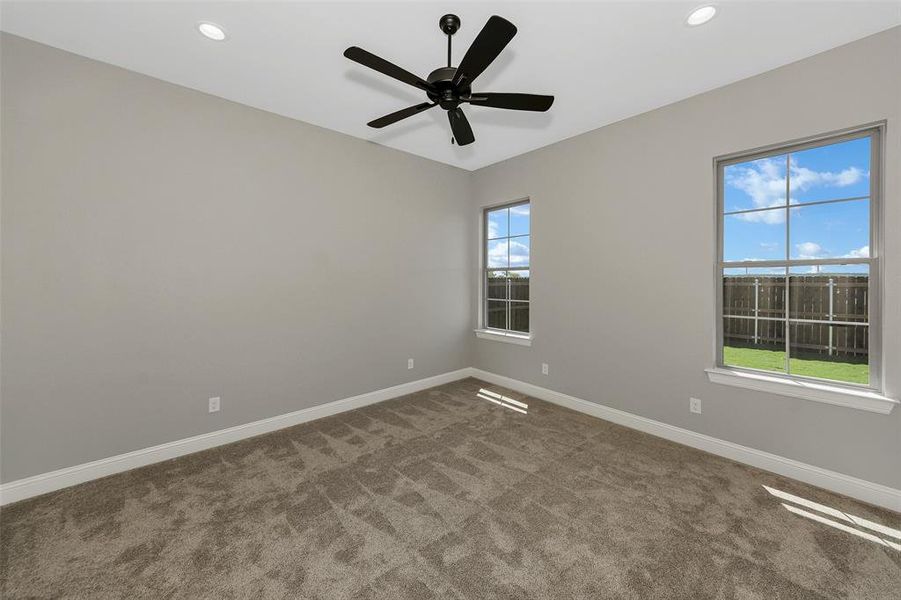 Empty room with carpet, recessed lighting, and ceiling fan