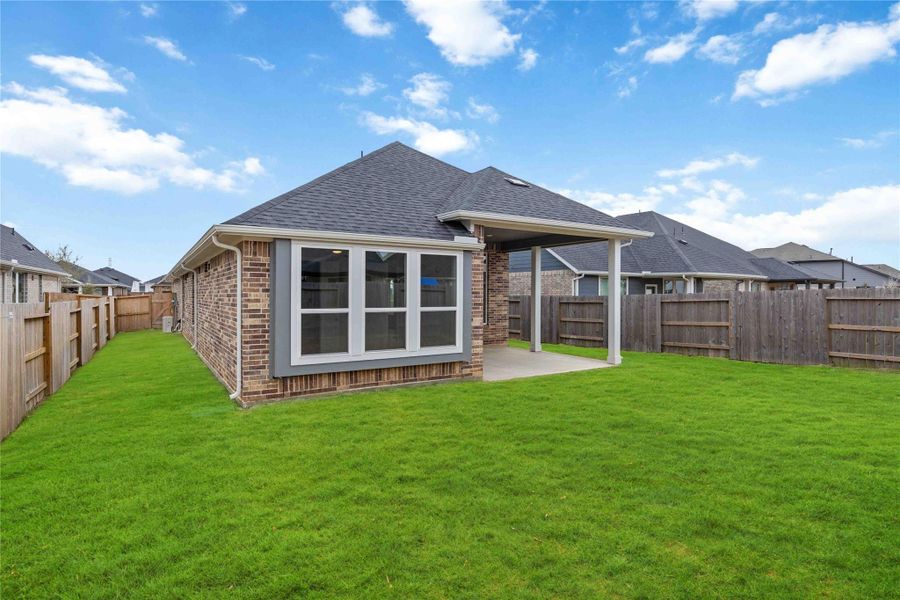 Exterior details and patio area of a home in Sunterra, Katy (Image 4). Exterior details and patio area of a home in Sunterra, Katy (Image 4).